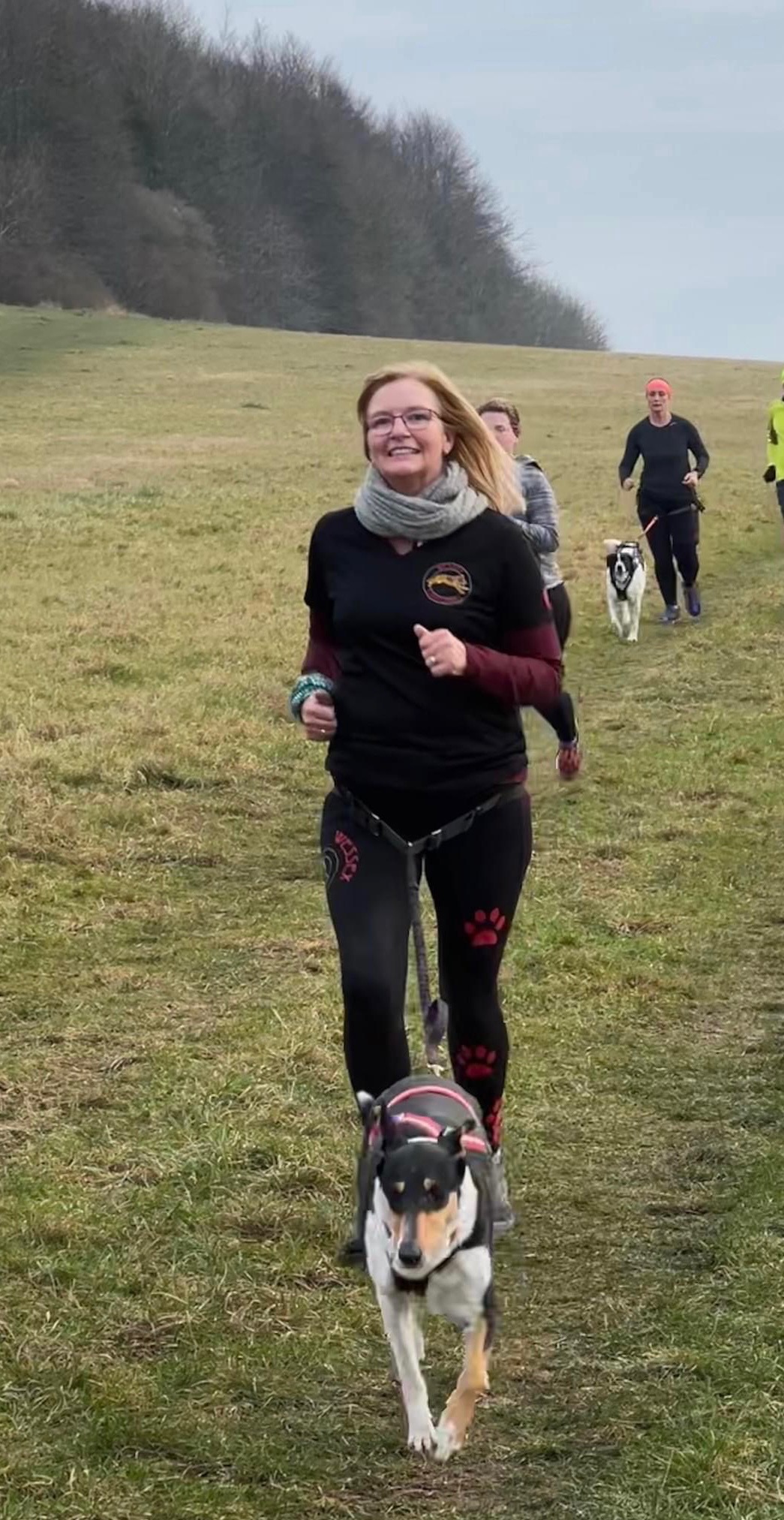 Ali canicross running with her dog in the Wiltshire countryside