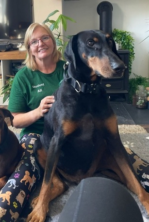 Axel the Doberman with his owner